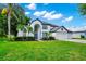 Attractive curb appeal with a lush green lawn and well-maintained landscaping at 3170 Zaharias Dr, Orlando, FL 32837