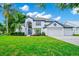 Beautiful two story home featuring manicured lawn, lush landscaping and a two car garage at 3170 Zaharias Dr, Orlando, FL 32837