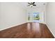 Bright living room with hardwood floors, crown molding, and sliding glass doors to the pool at 3170 Zaharias Dr, Orlando, FL 32837
