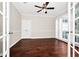 Charming living room showcasing gorgeous wood floors, large windows, and decorative trim at 3170 Zaharias Dr, Orlando, FL 32837