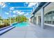 An inviting screened-in pool with a water feature adjoins a spacious deck, great for entertaining at 3170 Zaharias Dr, Orlando, FL 32837