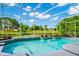 Screened-in pool with view of pond at 3170 Zaharias Dr, Orlando, FL 32837