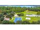 Aerial view of a community park with a basketball court and parking at 3378 Sagebrush St, Harmony, FL 34773