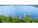 Beautiful aerial view of a lake with a private dock at 3378 Sagebrush St, Harmony, FL 34773
