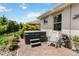 Inviting backyard with hot tub, brick patio, and well-maintained landscaping for relaxation and outdoor enjoyment at 3378 Sagebrush St, Harmony, FL 34773