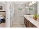 Bright bathroom features a glass shower, double sink vanity, and modern hardware at 3378 Sagebrush St, Harmony, FL 34773