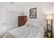 Bright bedroom with a dresser, and white closet doors at 3378 Sagebrush St, Harmony, FL 34773