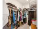 Organized walk-in closet with ample storage solutions and a full inventory of clothing and personal items at 3378 Sagebrush St, Harmony, FL 34773