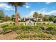 Welcoming entrance to The Lakes Amenities Center, showcasing lush landscaping and a well-maintained property at 3378 Sagebrush St, Harmony, FL 34773