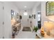 Bright foyer with white tile flooring, decorated tables, and ample natural light at 3378 Sagebrush St, Harmony, FL 34773