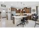 Bright kitchen boasts stainless steel appliances, a large island with seating, and ample cabinet space at 3378 Sagebrush St, Harmony, FL 34773