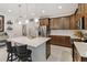 Bright and open kitchen featuring a large island, stainless steel appliances, and modern finishes at 3378 Sagebrush St, Harmony, FL 34773