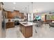 Spacious kitchen with stainless steel appliances, a large island, and open access to living spaces at 3378 Sagebrush St, Harmony, FL 34773
