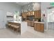 Modern kitchen with sleek countertops, stainless steel appliances, and seating at the island, perfect for gathering at 3378 Sagebrush St, Harmony, FL 34773