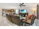 Inviting living room with ceiling fan and comfortable seating, open to the modern kitchen at 3378 Sagebrush St, Harmony, FL 34773