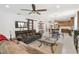 Open floor plan with kitchen and living areas featuring stylish decor and a modern sliding barn door at 3378 Sagebrush St, Harmony, FL 34773
