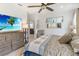 Relaxing main bedroom with ceiling fan and bright natural light has ensuite access at 3378 Sagebrush St, Harmony, FL 34773