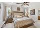 Comfortable main bedroom features a ceiling fan, neutral color scheme and bright, natural light at 3378 Sagebrush St, Harmony, FL 34773