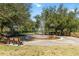 Community park featuring splashpad, benches, and walking path for Gathering fun at 3378 Sagebrush St, Harmony, FL 34773