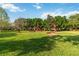 Scenic park with lush green grass and interesting art installations, perfect for outdoor recreation and relaxation at 3378 Sagebrush St, Harmony, FL 34773