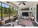 Inviting screened-in patio with wicker furniture and a view of the outdoors at 3378 Sagebrush St, Harmony, FL 34773