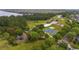 Aerial view of community park featuring basketball court, covered playground, walking trails, and ample green space at 3425 Middlebrook Pl, Harmony, FL 34773
