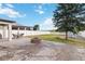 Large backyard with a brick patio, fire pit, and a view of the neighboring pond at 3425 Middlebrook Pl, Harmony, FL 34773