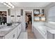Large bathroom with double sinks, a walk-in closet, and a large tub with a shower at 3425 Middlebrook Pl, Harmony, FL 34773
