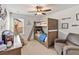 Bedroom with a bunk bed, chair, and natural light from a window at 3425 Middlebrook Pl, Harmony, FL 34773