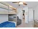 Bedroom featuring a bunk bed, chair, and a walk-in closet at 3425 Middlebrook Pl, Harmony, FL 34773
