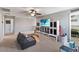 Bonus room with vaulted ceilings, a ceiling fan, TV, and plentiful storage at 3425 Middlebrook Pl, Harmony, FL 34773
