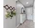 Hallway featuring tiled floor and storage cabinet with decor at 3425 Middlebrook Pl, Harmony, FL 34773