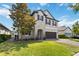 Attractive home featuring stone accents, well-maintained lawn and a two-car garage at 3425 Middlebrook Pl, Harmony, FL 34773