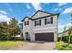 Two-story home boasting stone accents, well-maintained lawn and a two-car garage at 3425 Middlebrook Pl, Harmony, FL 34773
