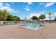 A large community pool is surrounded by lounge chairs and palm trees at 3425 Middlebrook Pl, Harmony, FL 34773