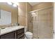 Well-maintained bathroom with a granite vanity and a glass-enclosed shower at 352 Alicante Ct, Davenport, FL 33837