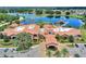 Aerial view of a clubhouse featuring a porte-cochere and nicely landscaped entry at 352 Alicante Ct, Davenport, FL 33837