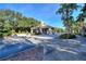 A community entrance featuring a charming guardhouse and picturesque landscaping at 352 Alicante Ct, Davenport, FL 33837