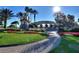A community entrance featuring a beautiful landscape, signage, and paved walkway at 352 Alicante Ct, Davenport, FL 33837