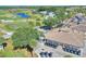 Aerial view of the golf clubhouse with golf carts parked outside on a sunny day at 352 Alicante Ct, Davenport, FL 33837