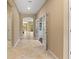 Hallway featuring tiled floors and white french doors, leading to other rooms at 352 Alicante Ct, Davenport, FL 33837