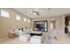 Comfortable living room with ample natural light, stylish furnishings, and an open connection to the kitchen at 352 Alicante Ct, Davenport, FL 33837