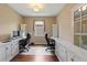 Bright office with two workstations and white cabinets for efficient storage at 352 Alicante Ct, Davenport, FL 33837