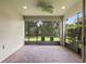 Spacious screened patio with brick flooring and ceiling fan, offering an inviting outdoor living space at 352 Alicante Ct, Davenport, FL 33837