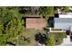 Aerial view of single-Gathering home with mature trees and lush landscaping surrounding the property at 453 E Jessup Ave, Longwood, FL 32750