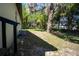 View of the backyard with lush landscaping and mature trees at 453 E Jessup Ave, Longwood, FL 32750