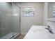 This bathroom has a walk-in shower and features a large sink and vanity at 453 E Jessup Ave, Longwood, FL 32750