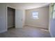 This bedroom has a closet and features clean lines and light wood-look flooring at 453 E Jessup Ave, Longwood, FL 32750