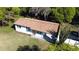 Aerial view of house with modern roofing and mature trees at 453 E Jessup Ave, Longwood, FL 32750