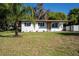 Charming single-story home with a freshly painted exterior and a well-manicured front yard at 453 E Jessup Ave, Longwood, FL 32750